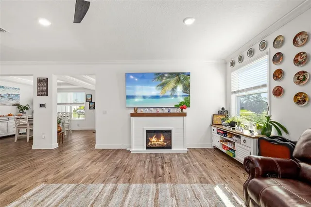 a view of a livingroom with wooden floor and a window