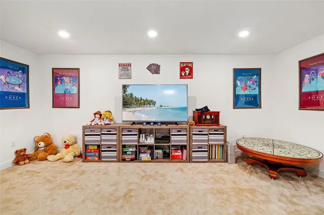 a bedroom with a bed and a dresser next to a window
