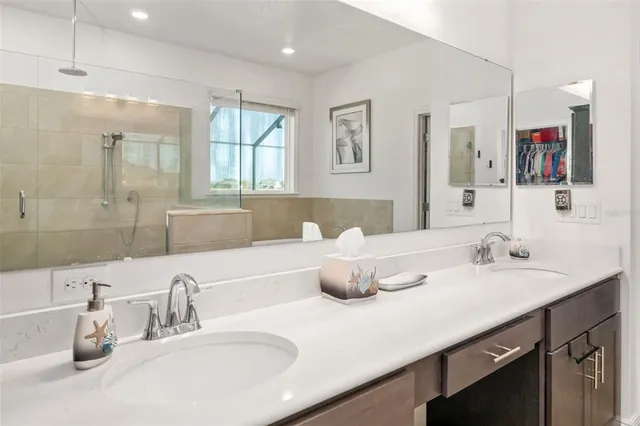 an aerial view of a houses with a lake view