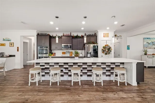 a kitchen with wooden cabinets and stainless steel appliances