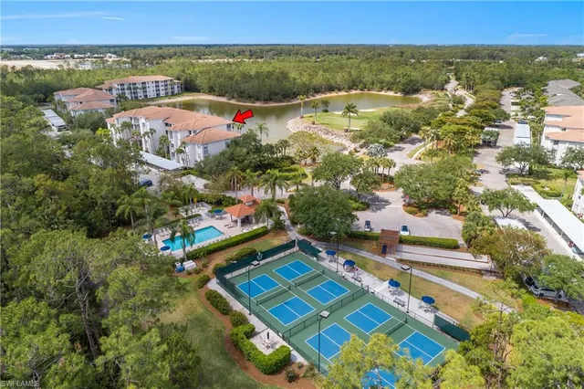an aerial view of residential house with outdoor space and swimming pool