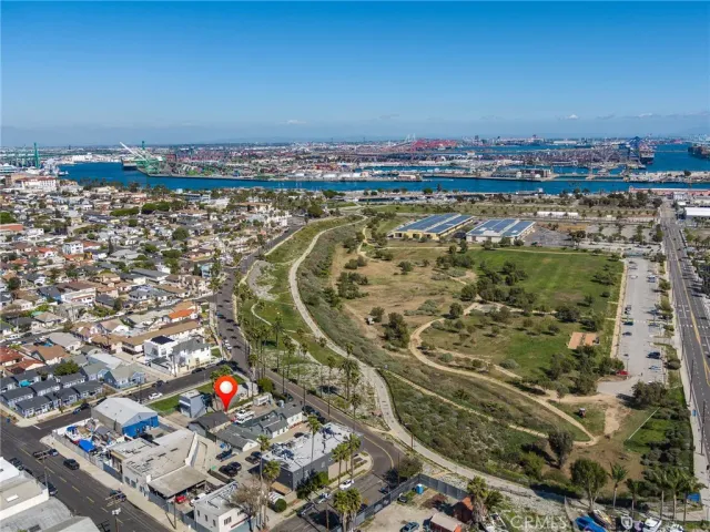 an aerial view of a residential apartment building with a yard