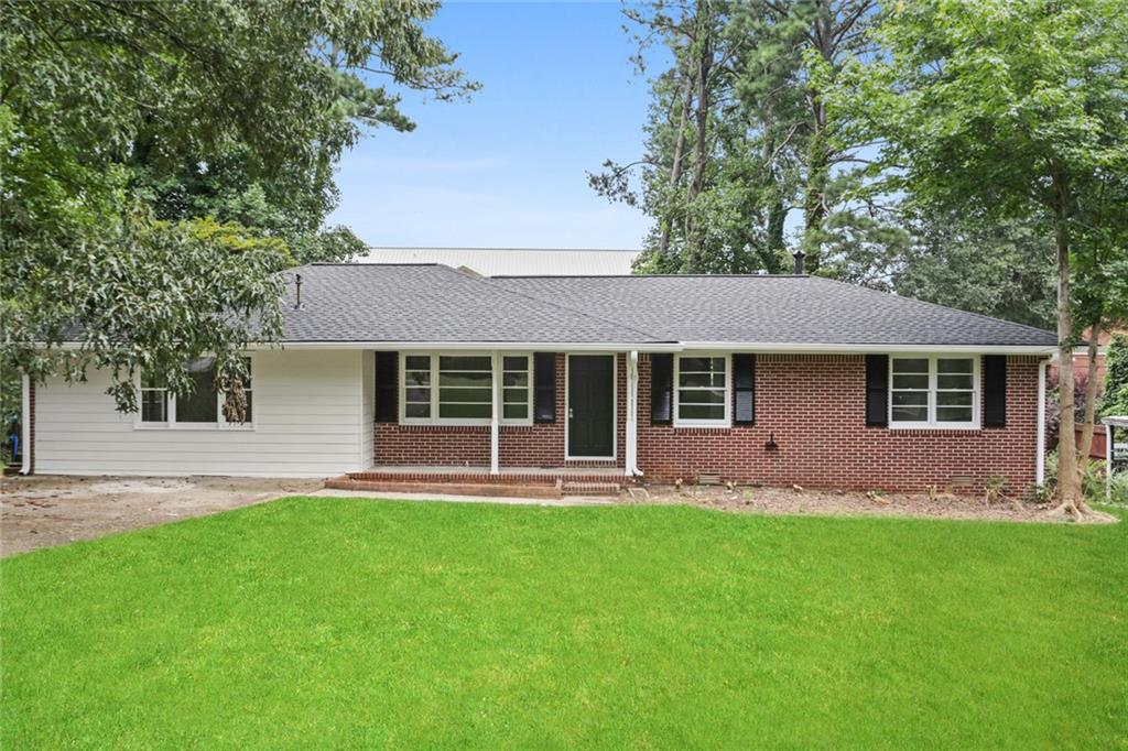 1023 Prospect Place Southwest Mableton, GA 30126 - Photo 1 of 1 front view of a house with a yard