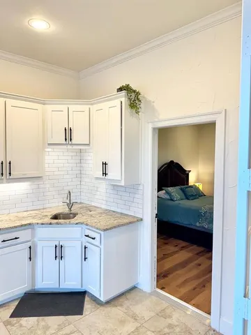 a view of a bathroom with a sink and mirror