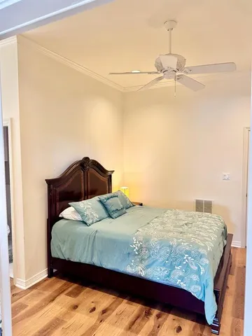 a bedroom with a bed and dresser