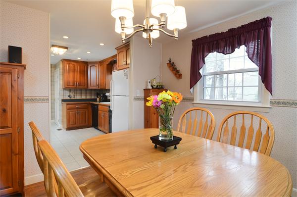 39 Summit Road Holbrook, MA 02343 - Photo 7 of 21 a kitchen with a table chairs dining table and stainless steel appliances