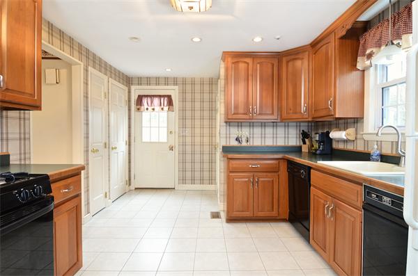 39 Summit Road Holbrook, MA 02343 - Photo 8 of 21 a kitchen with stainless steel appliances granite countertop a stove top oven a sink dishwasher and a refrigerator