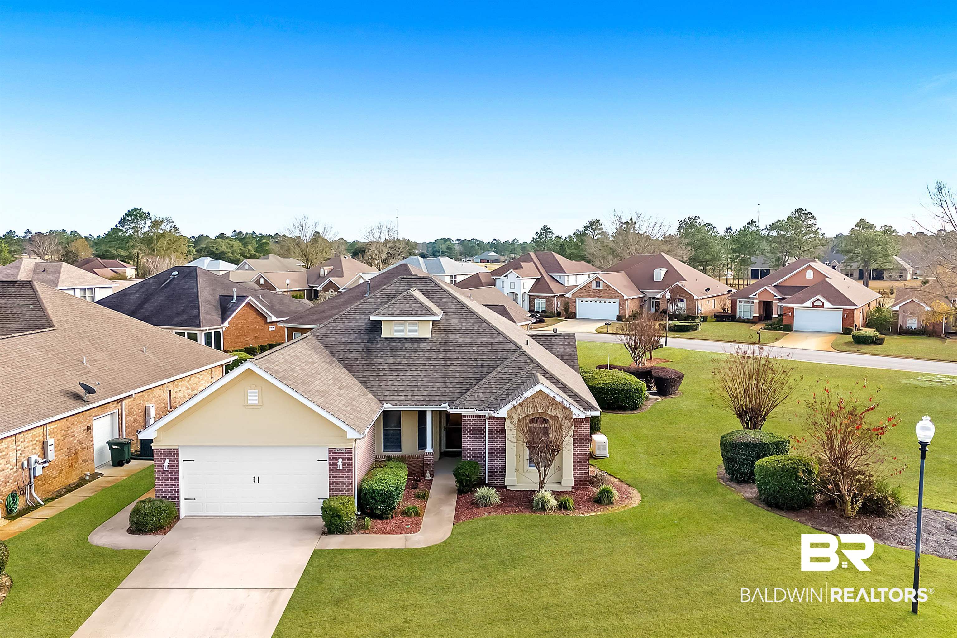 22726 Inverness Way Foley, AL 36535 - Photo 2 of 51 View of front of house with a garage and a front lawn