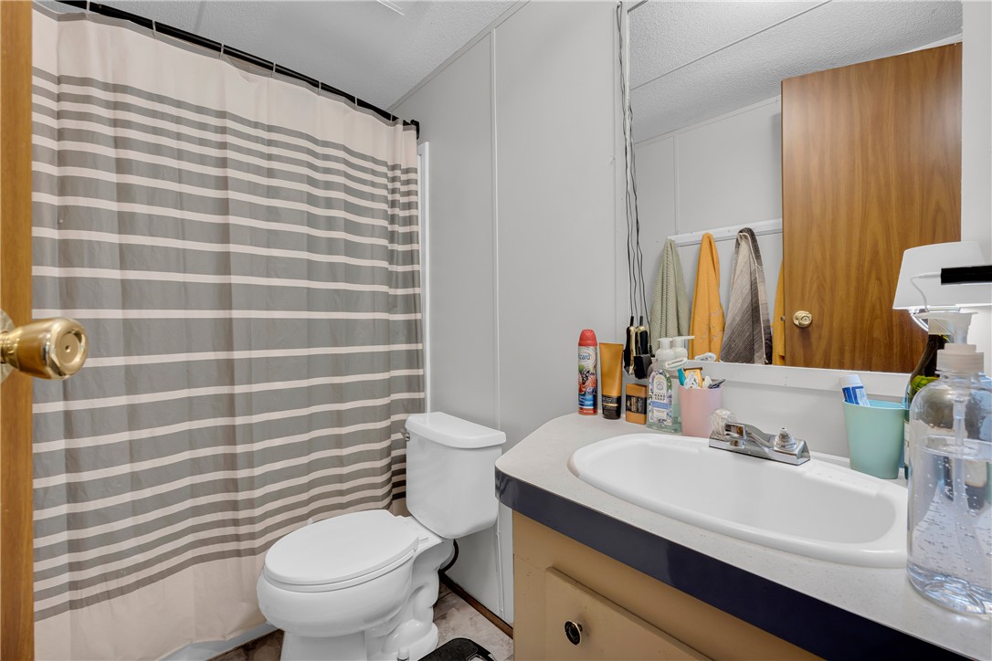 162 Newberry Road Walhalla, SC 29691 - Photo 27 of 50 Functional full bathroom featuring a convenient vanity and a shower with a privacy curtain.