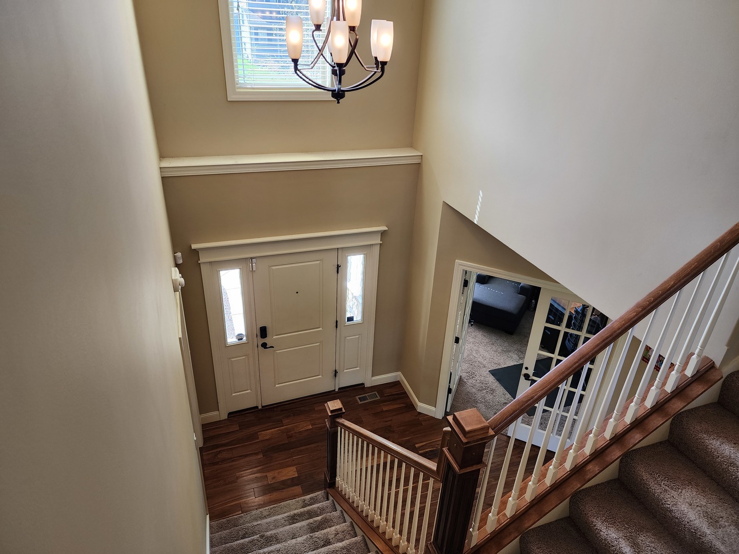 2008 Savanna Drive Champaign, IL 61822 - Photo 3 of 62 a view of a hallway with wooden floor and staircase