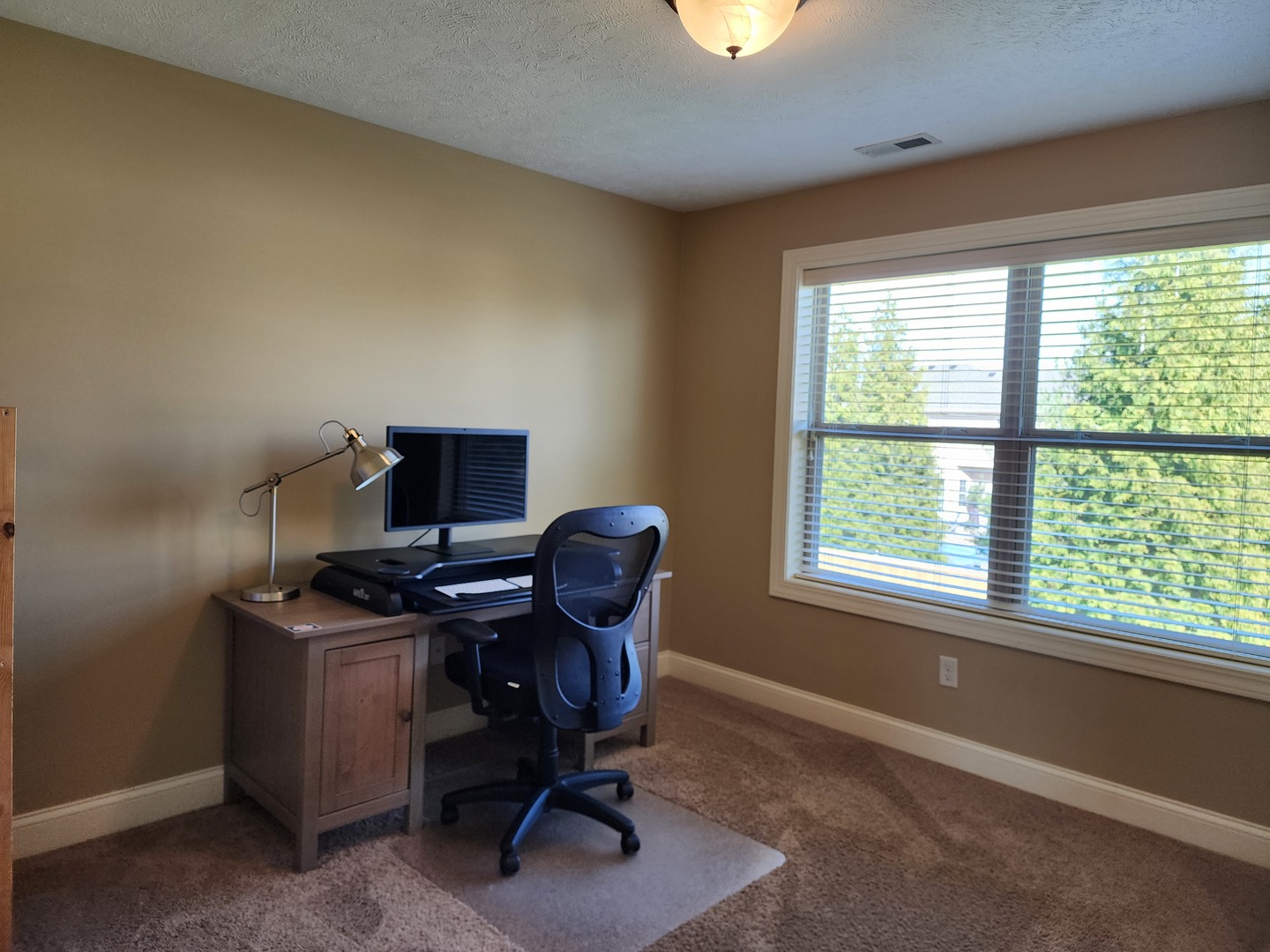 2008 Savanna Drive Champaign, IL 61822 - Photo 34 of 62 a view of a workspace with furniture and a window