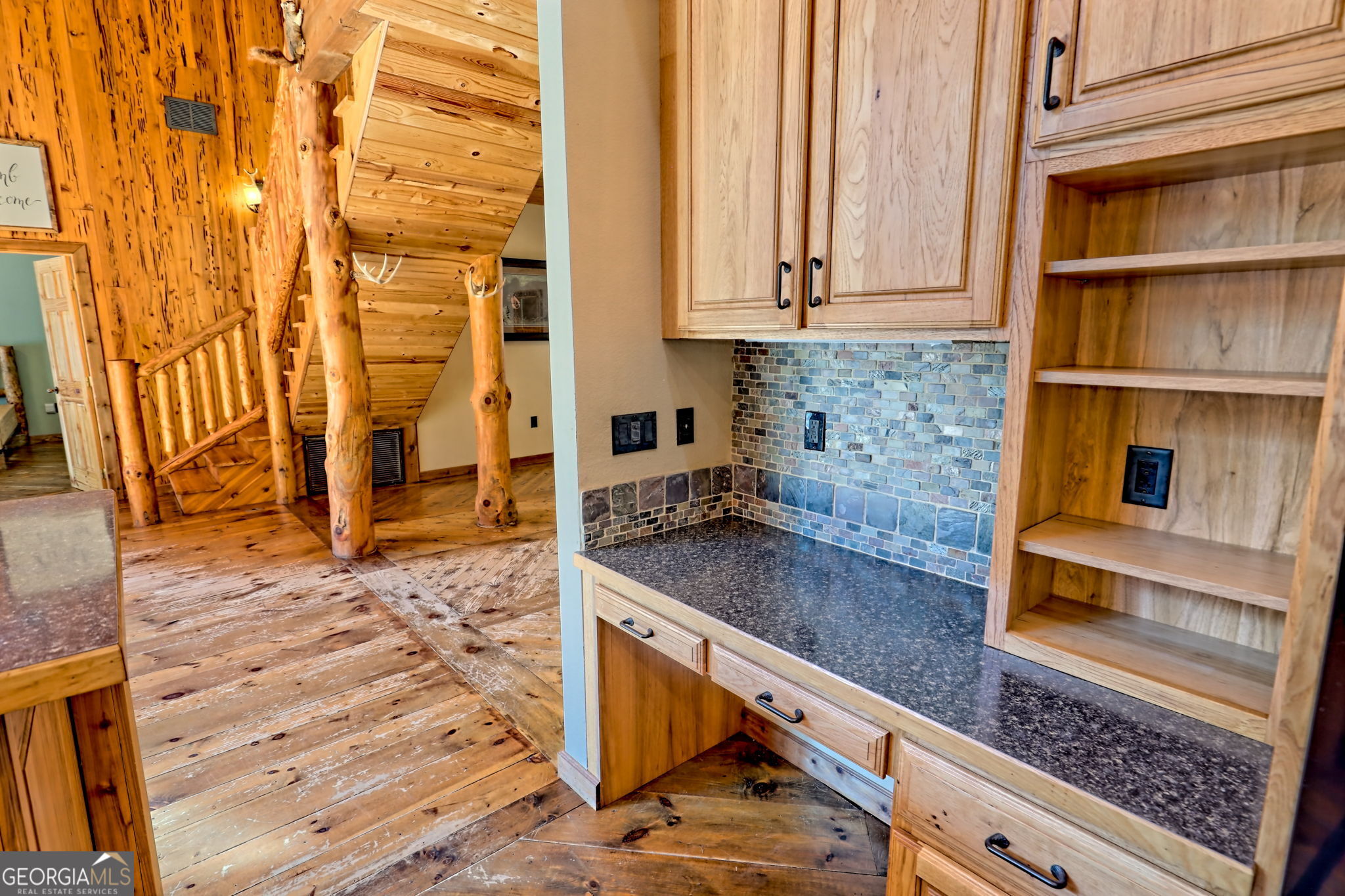 199 Camelia Lane Tiger, GA 30576 - Photo 25 of 100 a kitchen with granite countertop a sink and a stove top oven