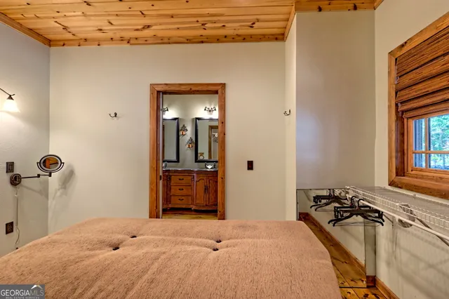 a view of a water pond with green field