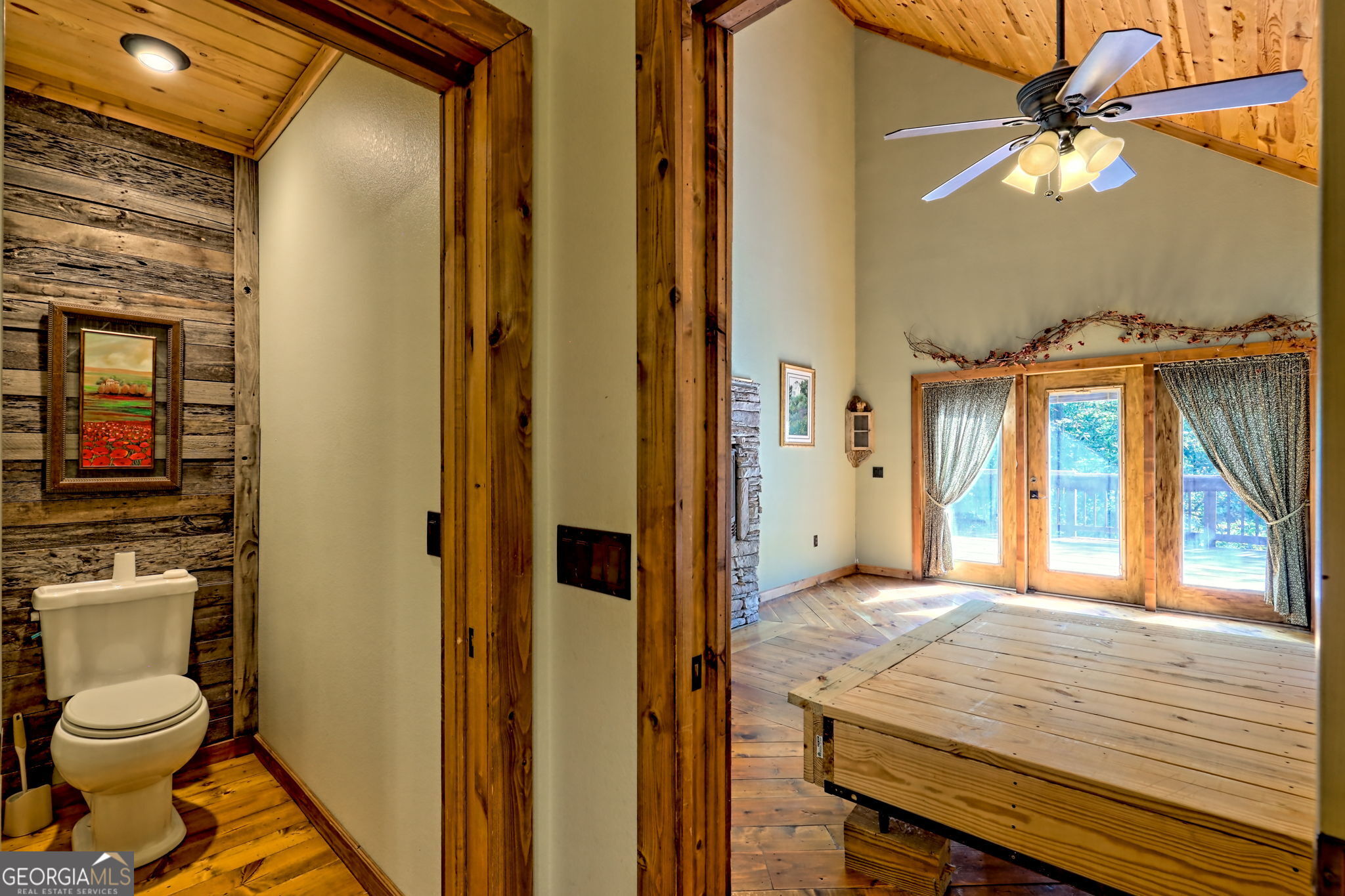 199 Camelia Lane Tiger, GA 30576 - Photo 45 of 100 a bathroom with a granite countertop sink and a mirror