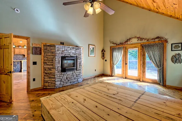 a backyard of a house with a yard and outdoor seating