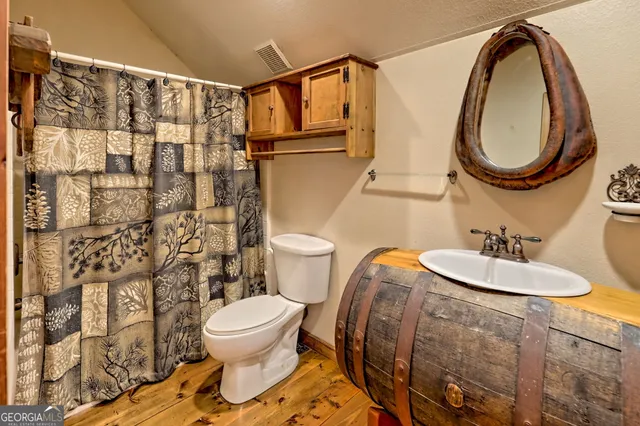 a backyard of a house with lots of green space and garden