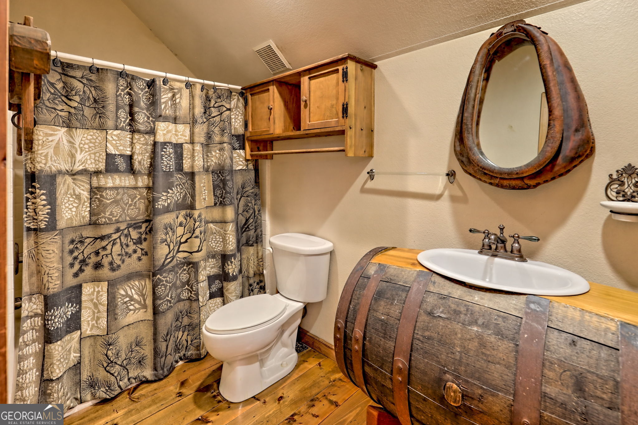 199 Camelia Lane Tiger, GA 30576 - Photo 50 of 100 a bathroom with a sink a toilet and a mirror
