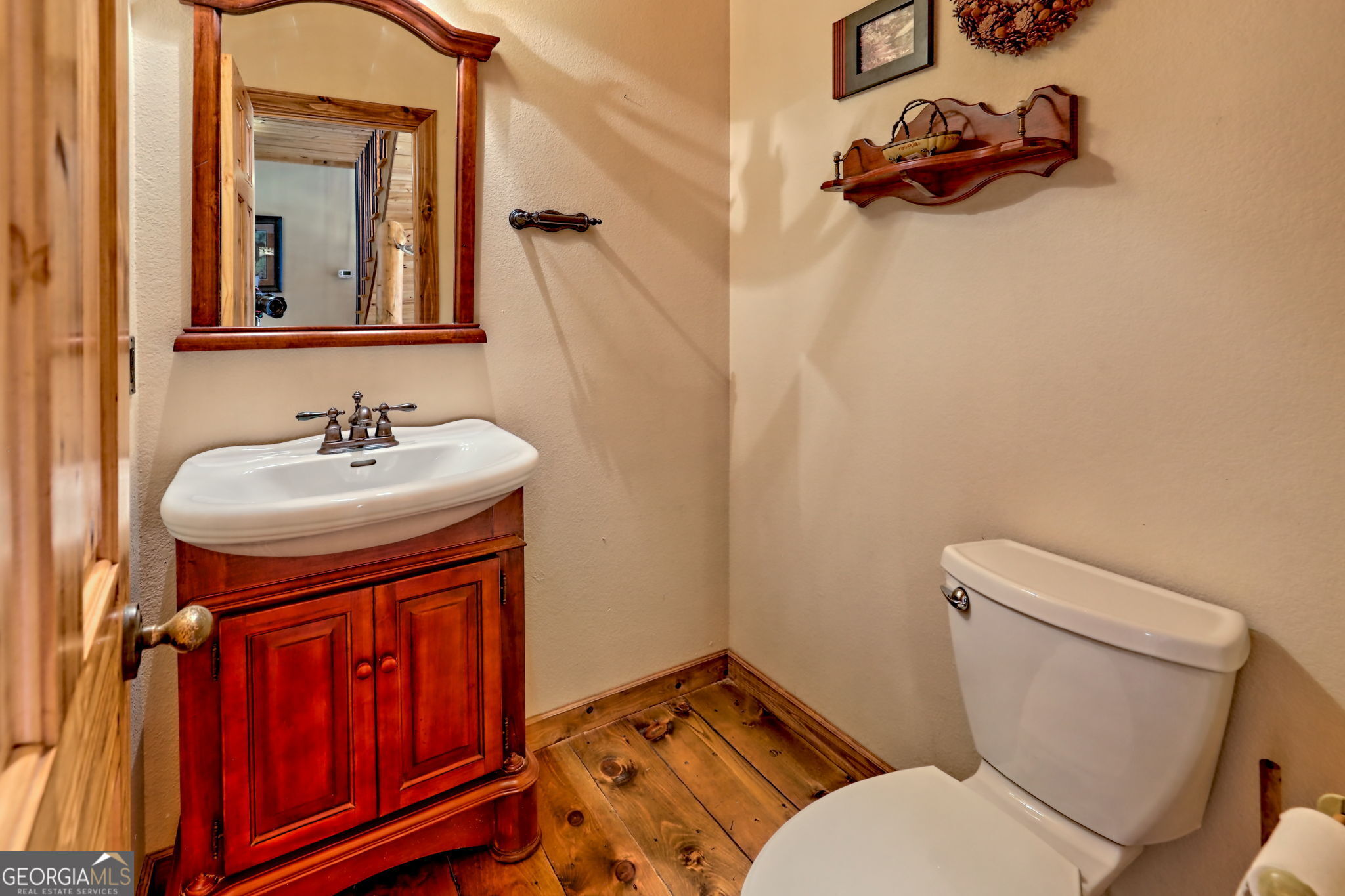 199 Camelia Lane Tiger, GA 30576 - Photo 60 of 100 a bathroom with a toilet sink and mirror