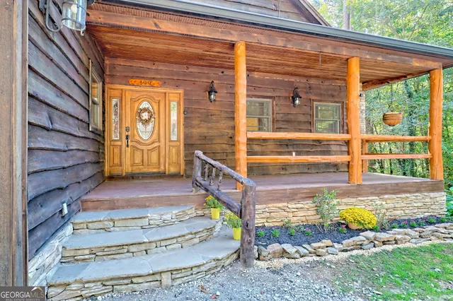 a view of a residential apartment building with a yard