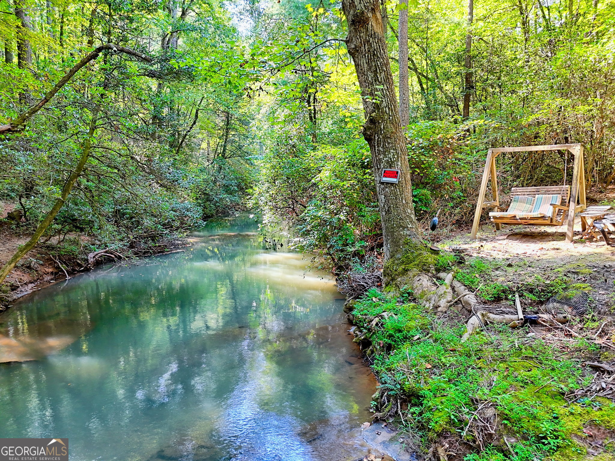 199 Camelia Lane Tiger, GA 30576 - Photo 92 of 100 a backyard of a house with a yard and outdoor seating