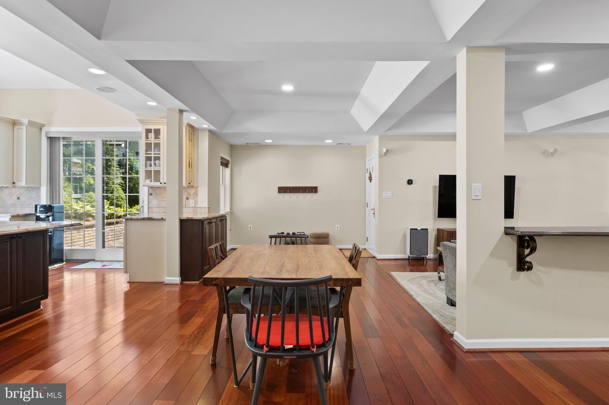 11019 Ring Road Reston, VA 20190 - Photo 12 of 78 a living room with furniture a large window wooden floor and a rug