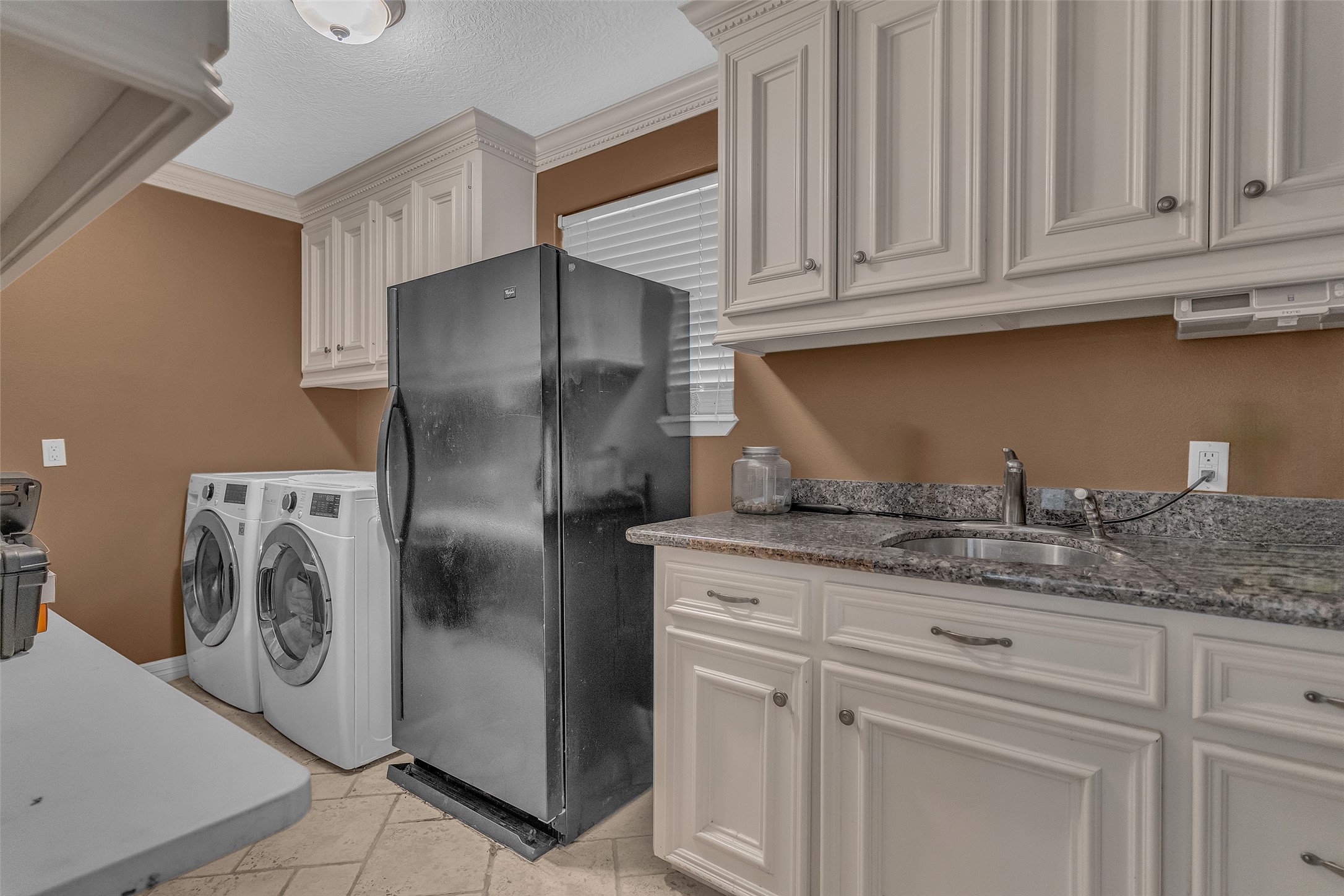 3519 Singleton Road Baytown, TX 77521 - Photo 32 of 42 walk-in laundry room with built in sink, granite countertops and custom cabinets