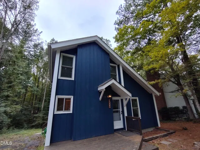 a front view of a house with yard
