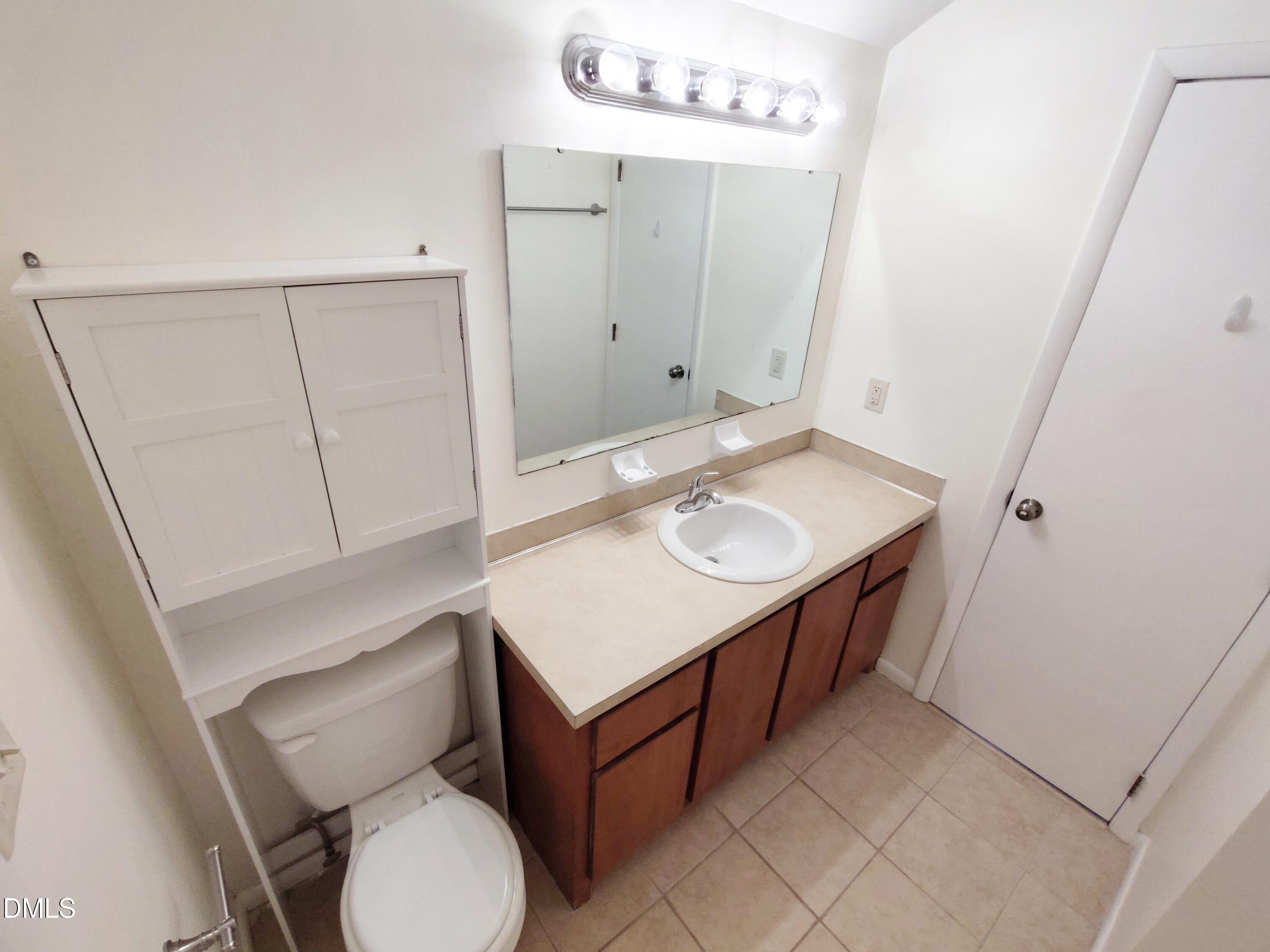 1321 Valley Run Durham, NC 27707 - Photo 14 of 19 a bathroom with a sink toilet and mirror