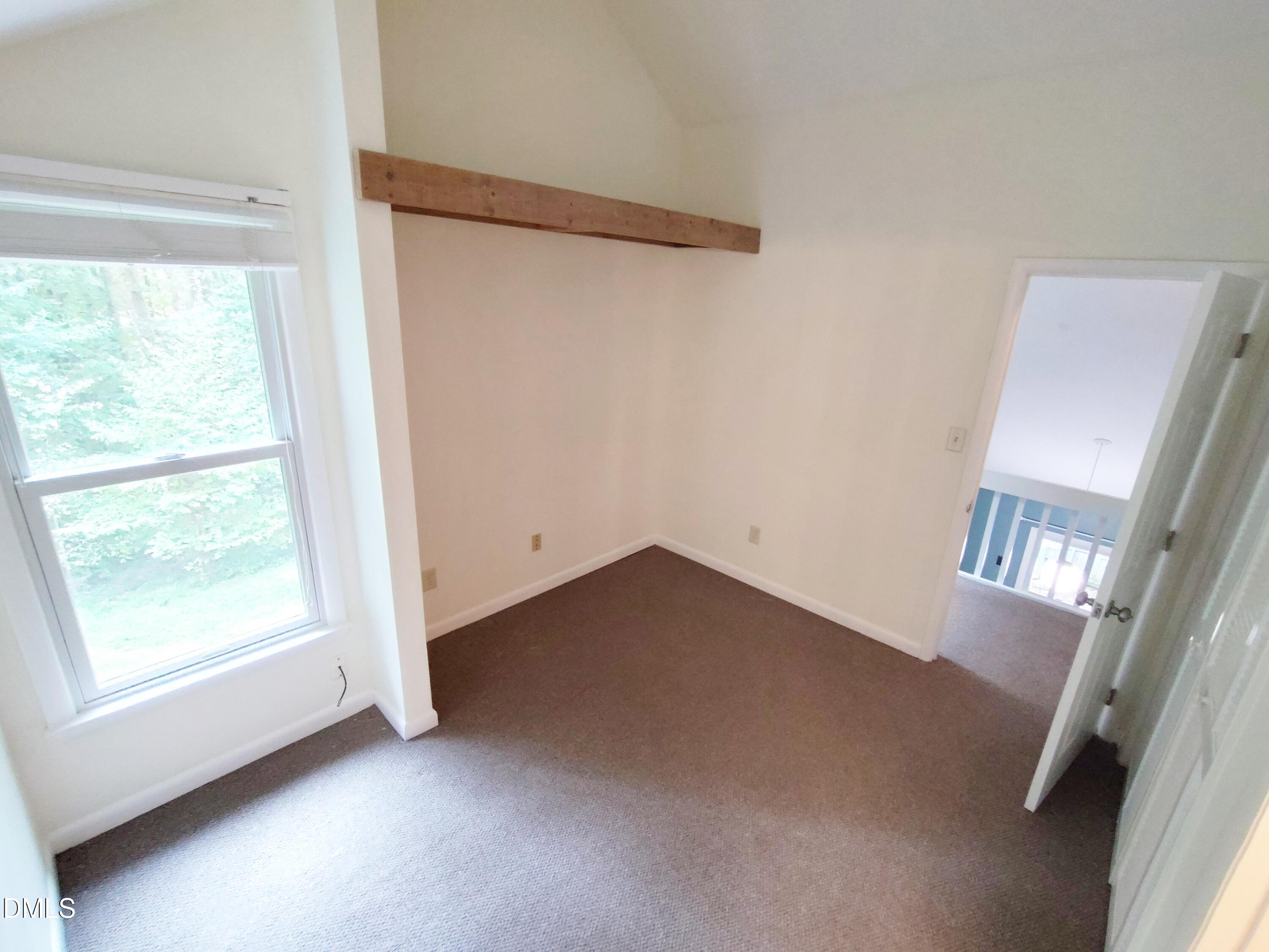 1321 Valley Run Durham, NC 27707 - Photo 15 of 19 a view of an empty room with wooden floor and a window