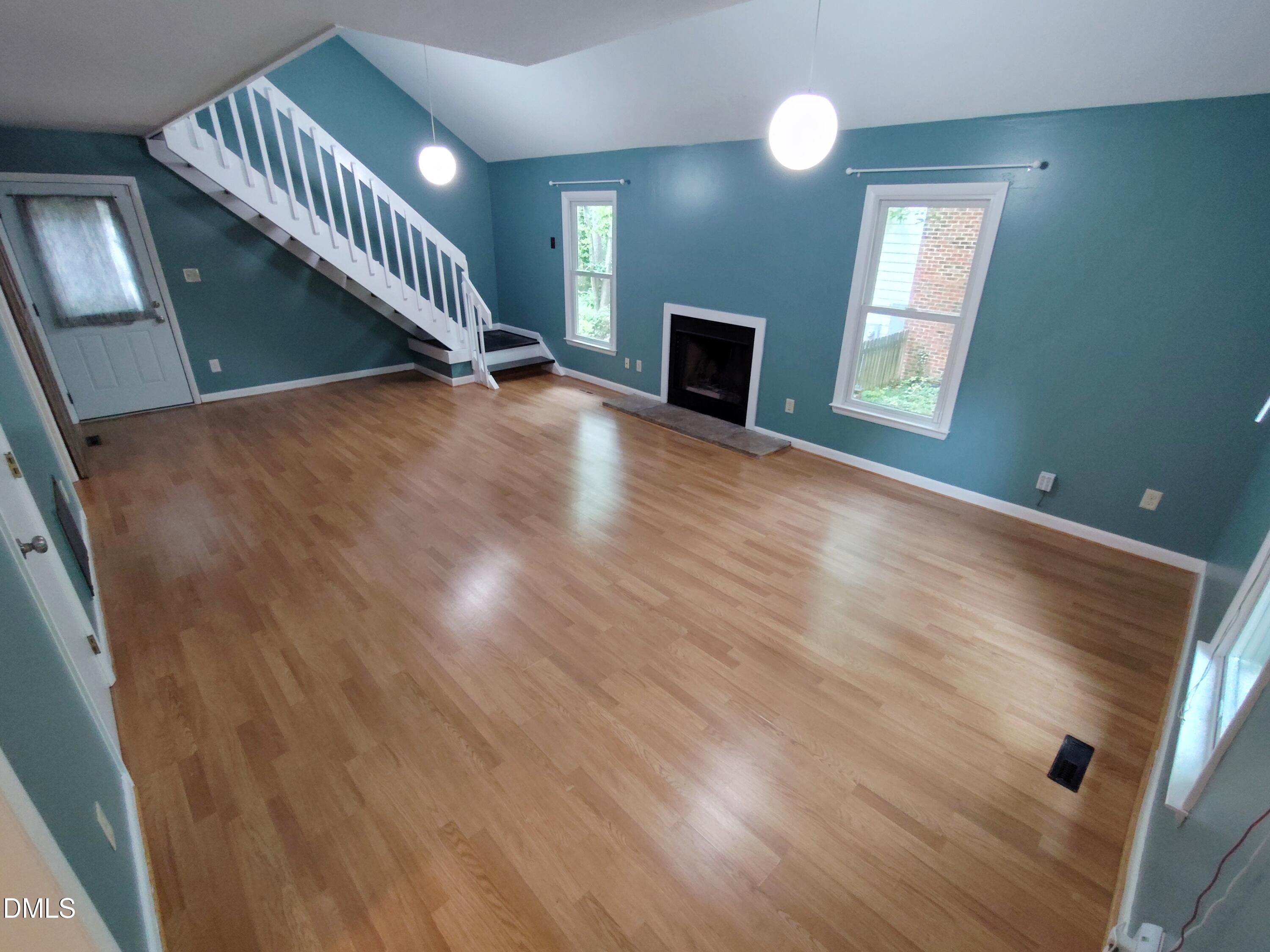1321 Valley Run Durham, NC 27707 - Photo 2 of 19 a view of an empty room with wooden floor and a window