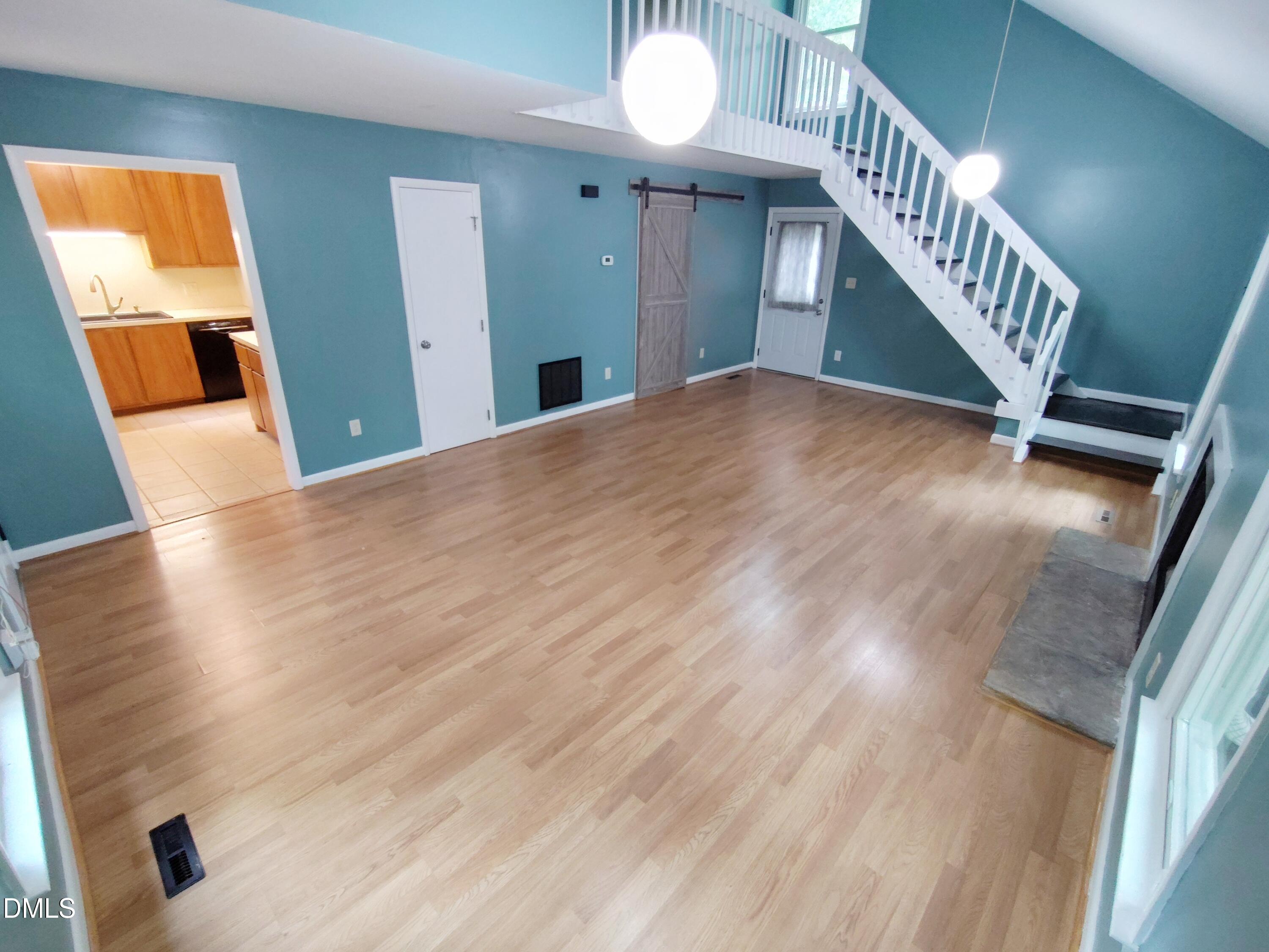 1321 Valley Run Durham, NC 27707 - Photo 3 of 19 a view of entryway and hall with wooden floor