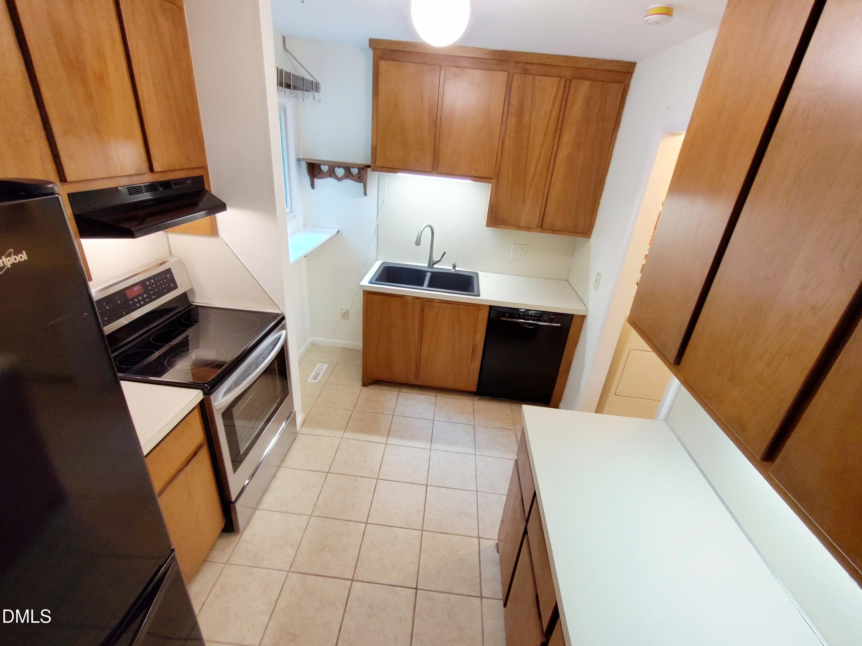 1321 Valley Run Durham, NC 27707 - Photo 6 of 19 a kitchen with a sink and a stove top oven