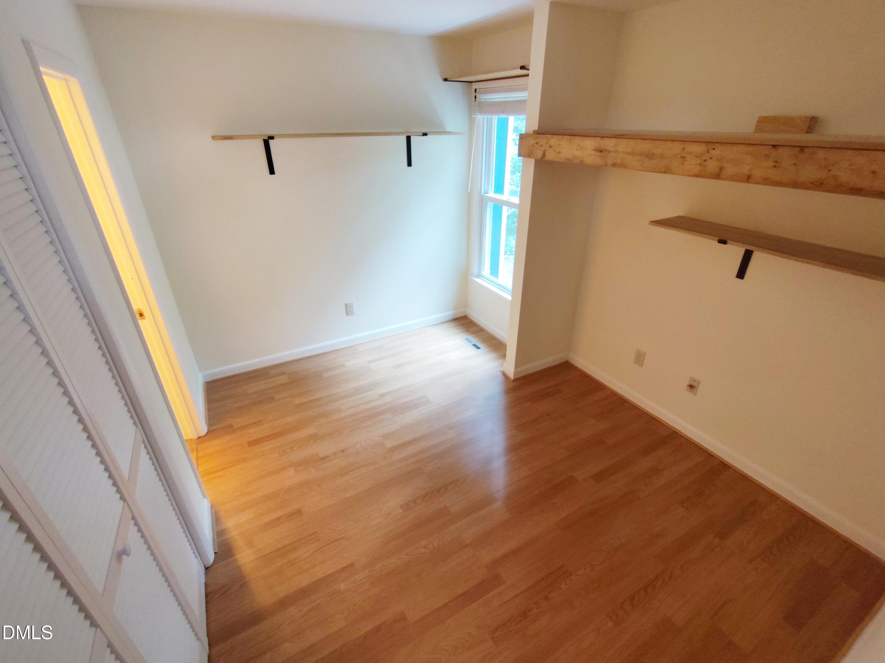 1321 Valley Run Durham, NC 27707 - Photo 8 of 19 a view of walk in closet with empty racks