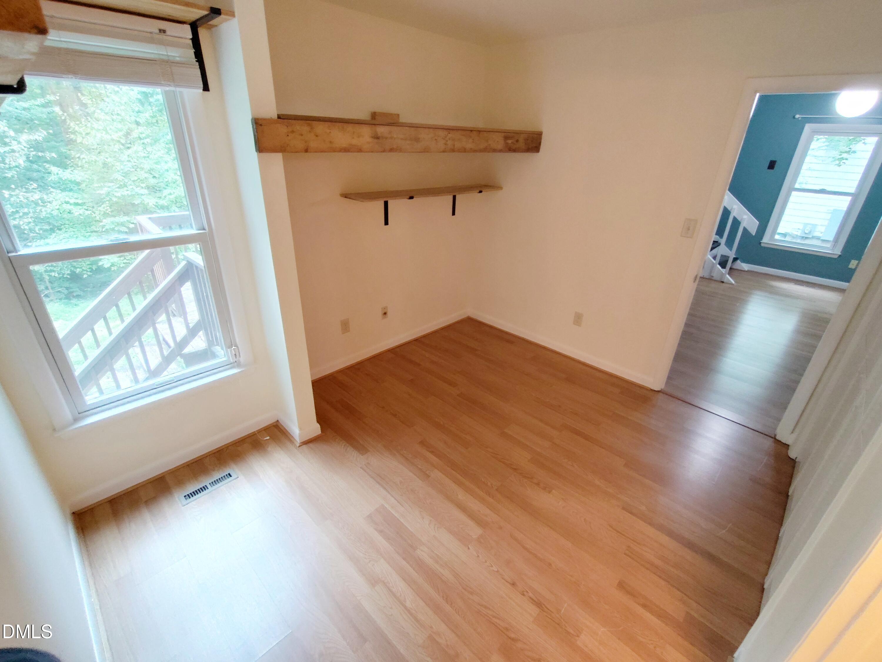 1321 Valley Run Durham, NC 27707 - Photo 9 of 19 a view of empty room with wooden floor and fan