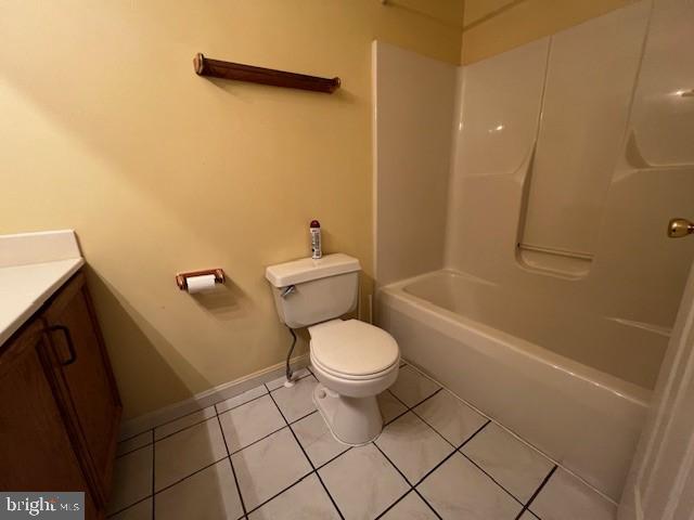 309 East 3rd Street, Unit B Frederick, MD 21701 - Photo 11 of 15 a white toilet sitting next to a bath tub