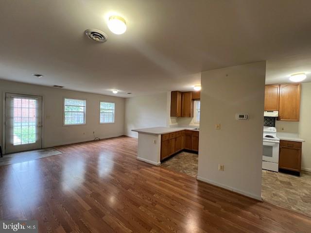309 East 3rd Street, Unit B Frederick, MD 21701 - Photo 5 of 15 a view of an empty room with window and wooden floor