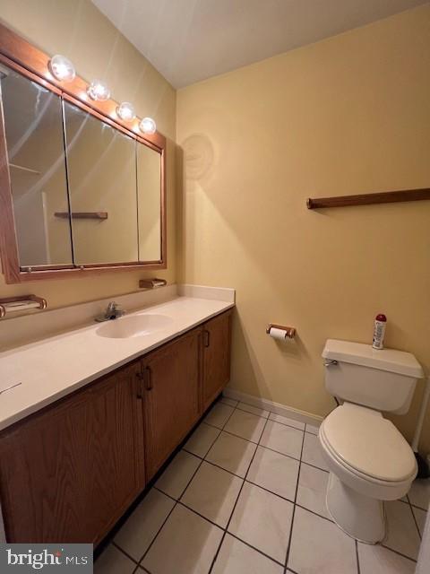 309 East 3rd Street, Unit B Frederick, MD 21701 - Photo 10 of 15 a bathroom with a sink mirror vanity and toilet
