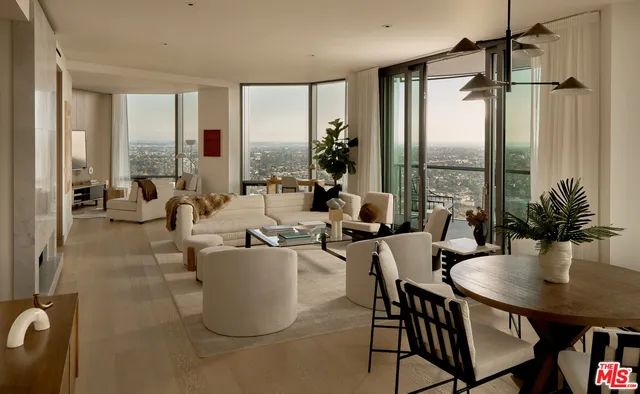 a living room with furniture and large windows