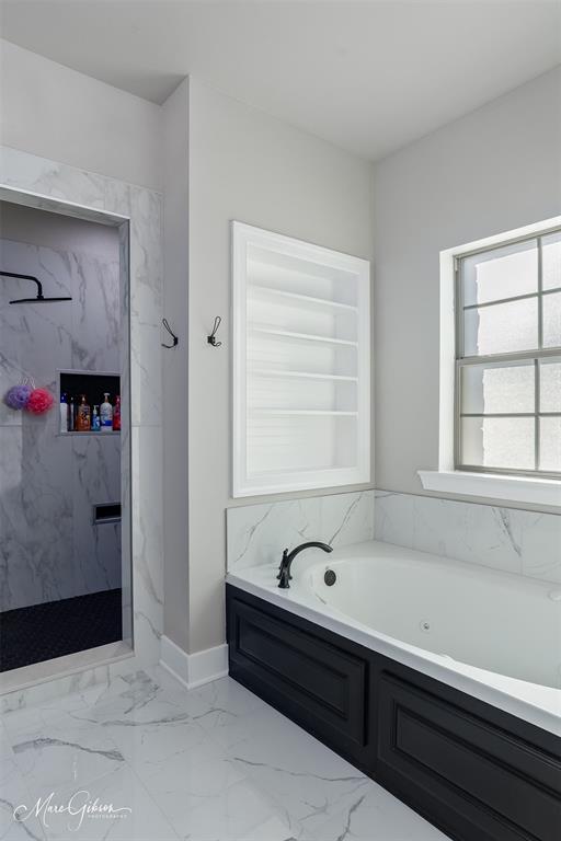 550 Linton Bellevue Road Benton, LA 71006 - Photo 29 of 37 Bathroom with light marble finish flooring, a garden tub, and a marble finish shower