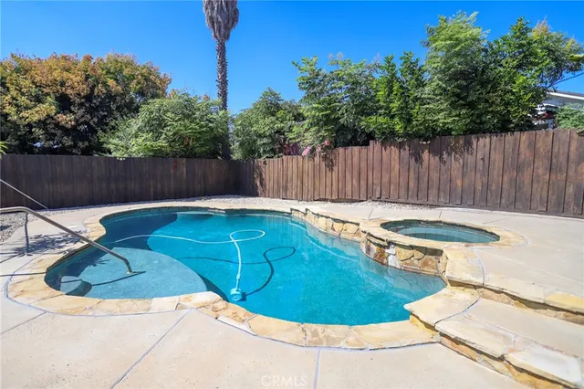 a view of a swimming pool with a chairs