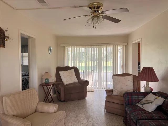 a living room with furniture and a window