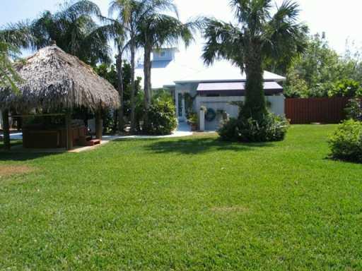 6 Ridgeview Road North Stuart, FL 34996 - Photo 5 of 8 a view of a house with a yard and basketball ground