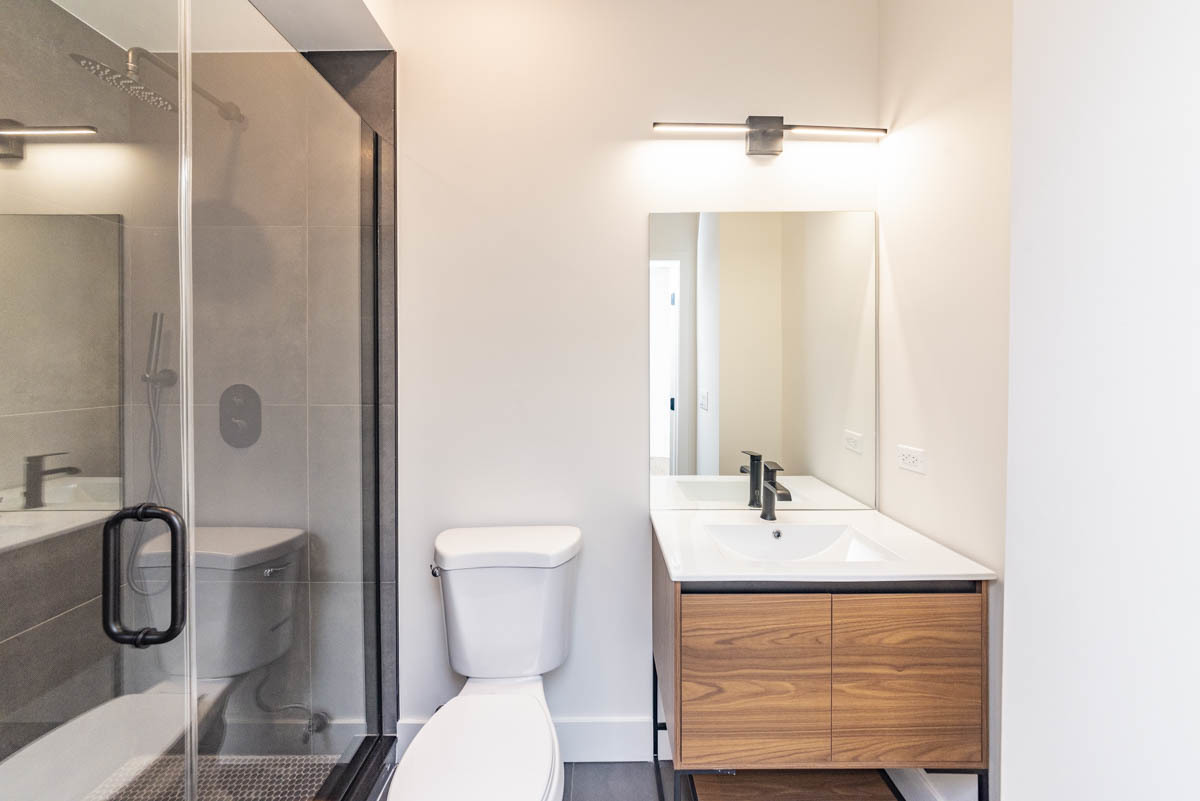 2825 North Rockwell Street, Unit 2 Chicago, IL 60618 - Photo 13 of 22 a bathroom with a toilet sink and shower