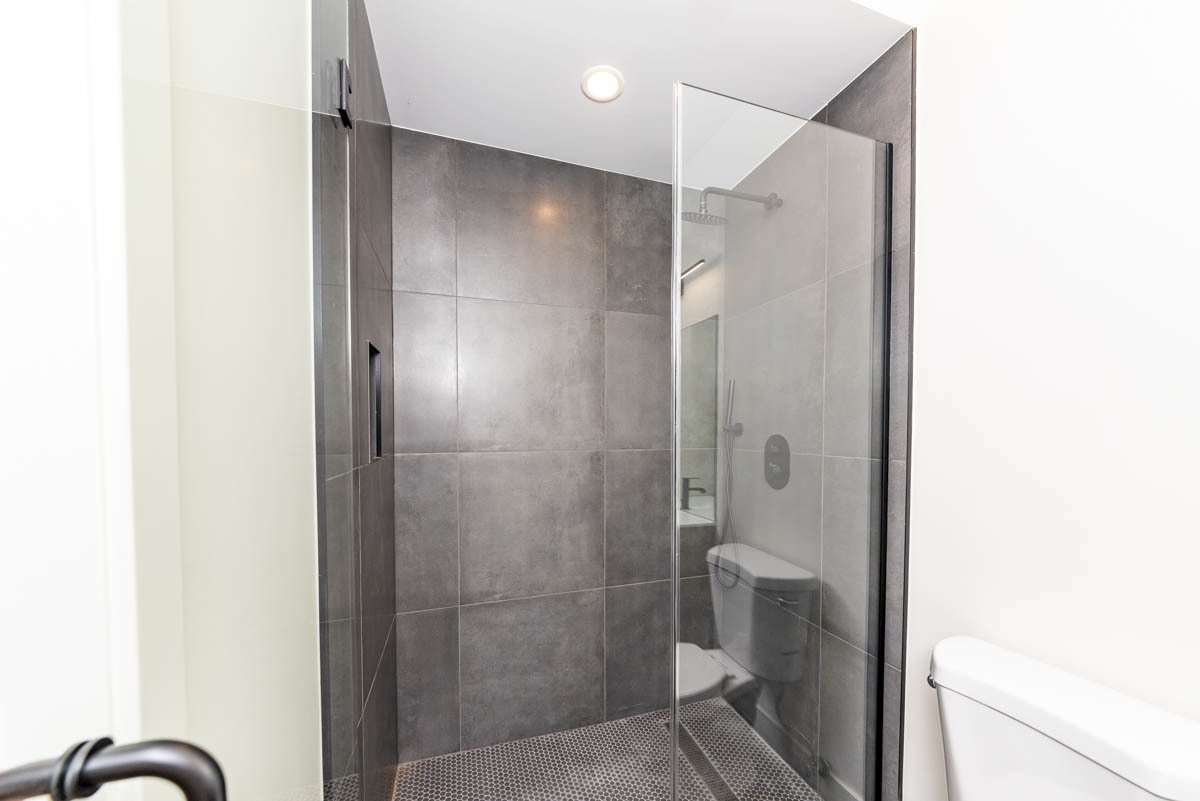 2825 North Rockwell Street, Unit 2 Chicago, IL 60618 - Photo 14 of 22 a bathroom with a shower and a sink