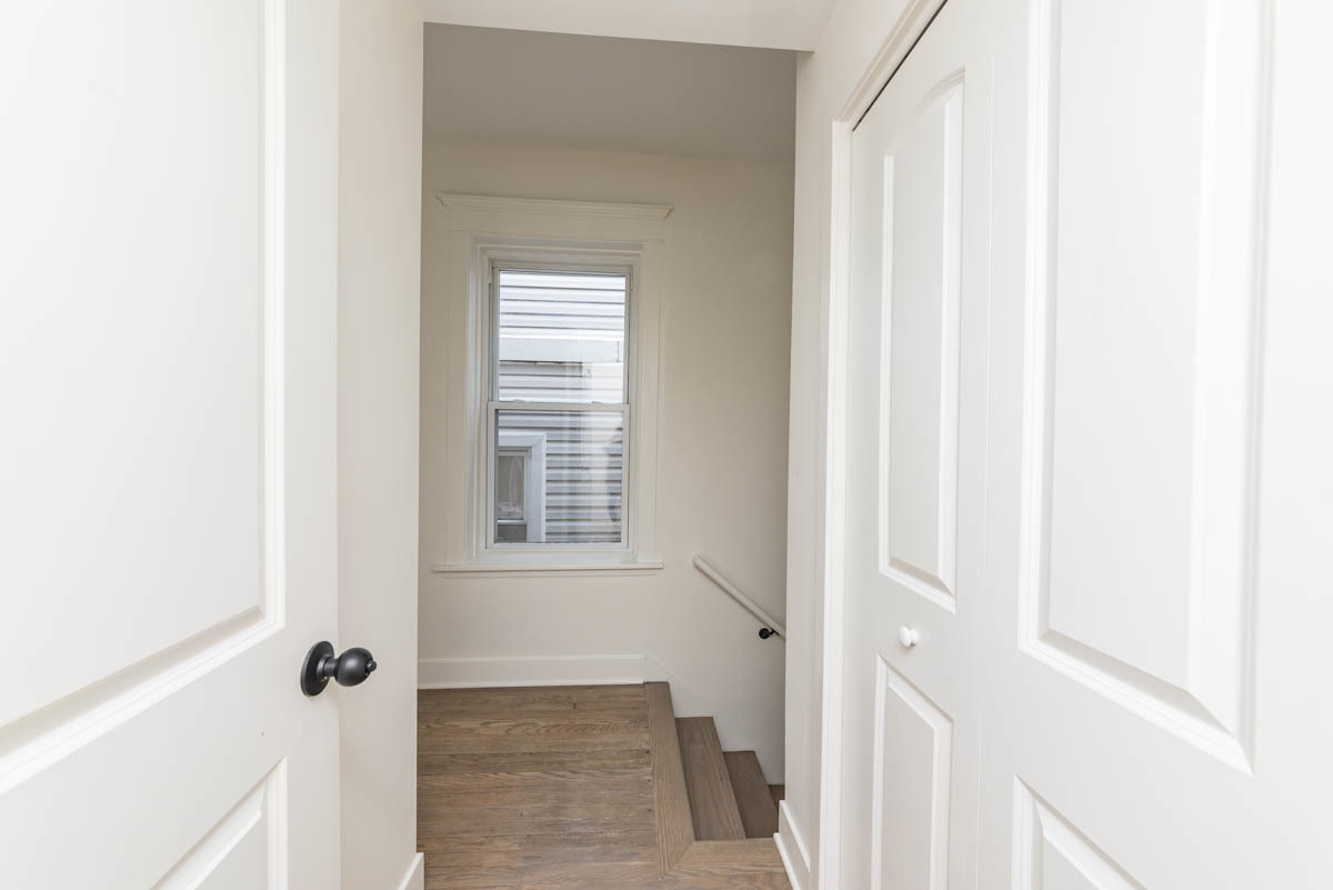 2825 North Rockwell Street, Unit 2 Chicago, IL 60618 - Photo 20 of 22 a view of a hallway with windows