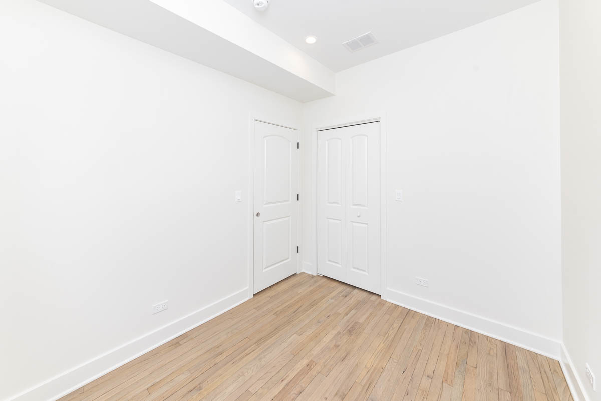 2825 North Rockwell Street, Unit 2 Chicago, IL 60618 - Photo 7 of 22 a view of a room with wooden floor