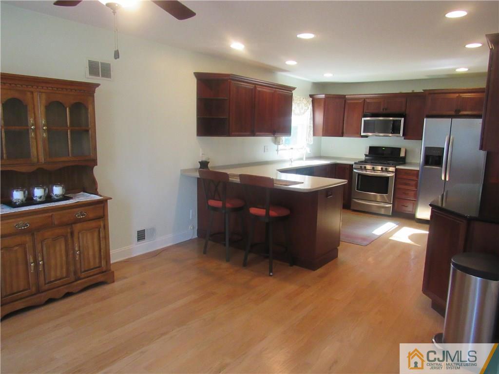 3 Hillsdale Road Edison, NJ 08820 - Photo 3 of 27 a kitchen with stainless steel appliances granite countertop a stove a sink a refrigerator and a microwave