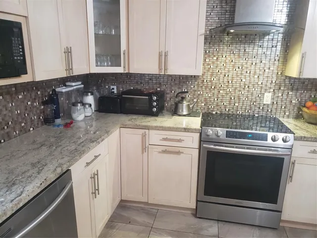 a white bath tub sitting in a bathroom