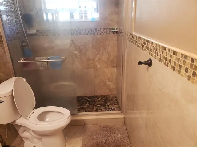 a view of swimming pool with seating space