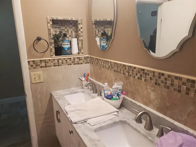 a view of a house with a yard and sitting area